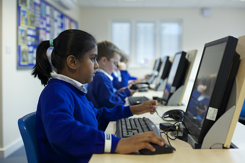 Children using computers in a school ICT suite.